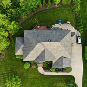 An aerial view of a house and lawn