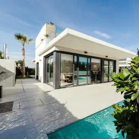 A modern white house with a pool